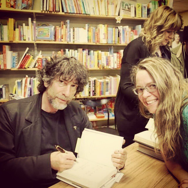 English Department Communications Coordinator Jill Salahub and author Neil Gaiman. Jill waited in line for seven hours at Old Firehouse Books to meet Gaiman, who stayed at that table signing books for eleven hours, until there was no more line.