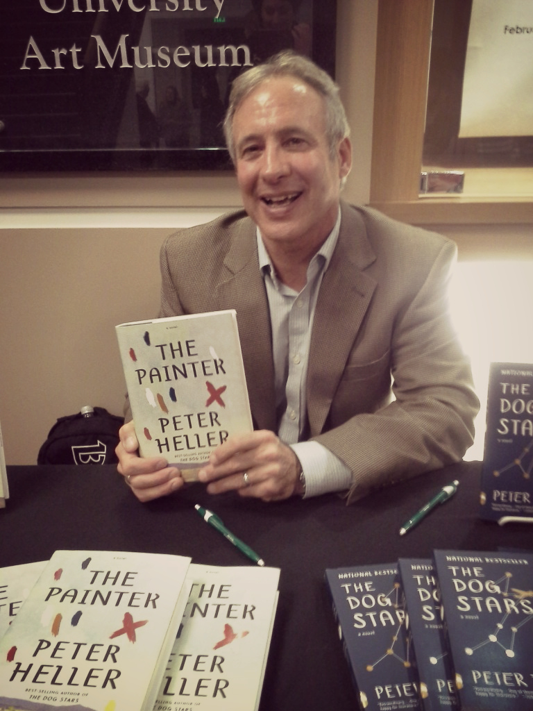 Peter Heller at the signing table with his novels, The Painter and The Dog Stars. Image by Kara Nosal.