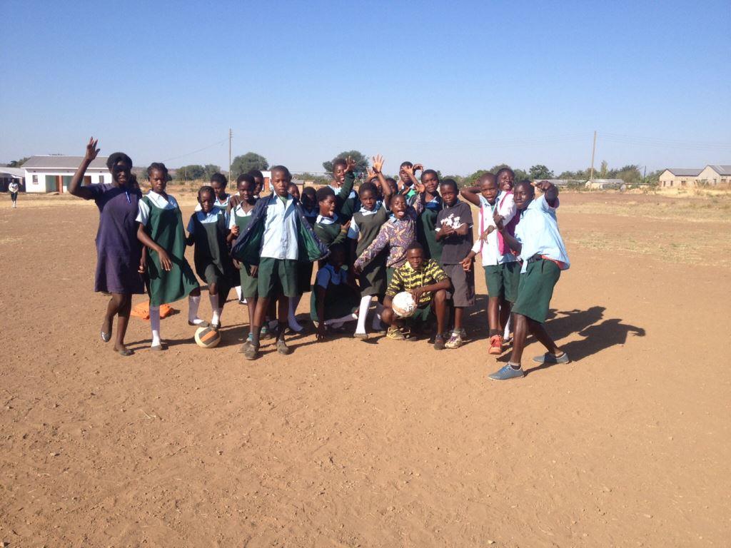 The 7th grade class at Libuyu Primary School with soccer balls donated by the CSU English Department