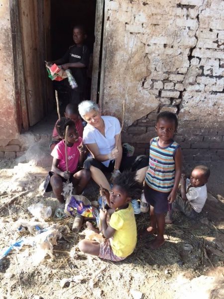 Ellen Brinks sitting with Zambian children