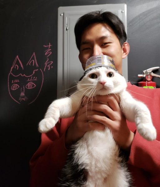 Frank Xia holding Jill the cat