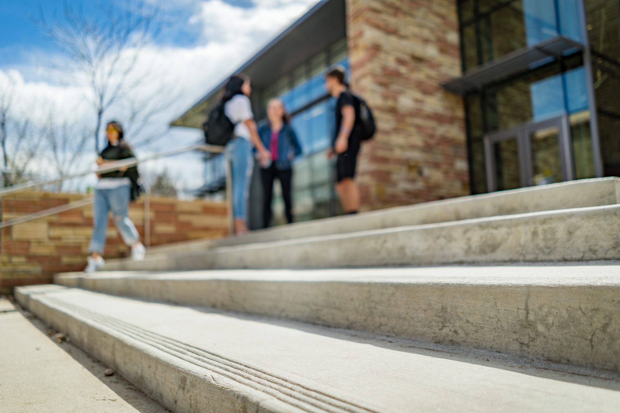 CSU students hanging out on the steps of Eddy Hall.