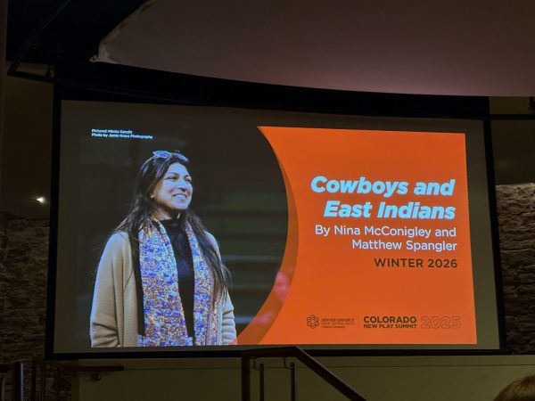 Screen projecting image of an actor alongside an announcement for "Cowboys and East Indians" winter 2026 premiere. 