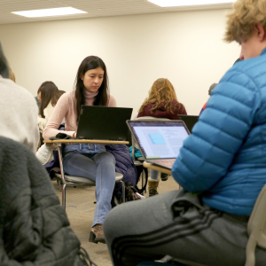 Students studying on laptops in CSU classroom.