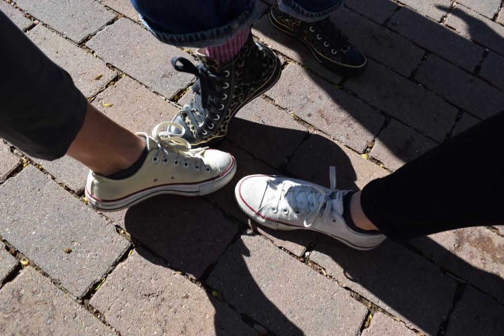 Professors Barb Sebek, Leslee Becker, and Roze Hentschell model the appropriate footwear for touring Eddy Hall