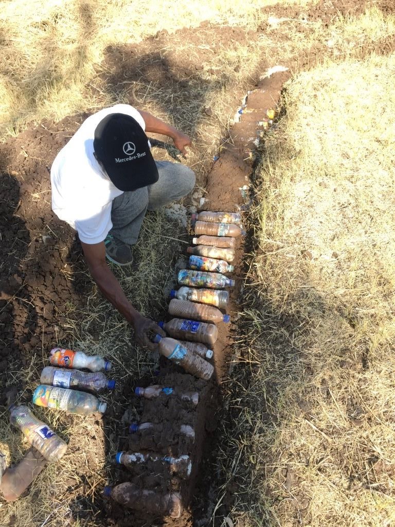 Local Linda Farm resident working on the compost with CSU.