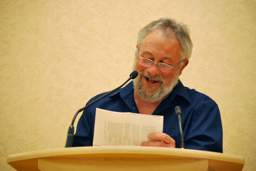 John at lectern