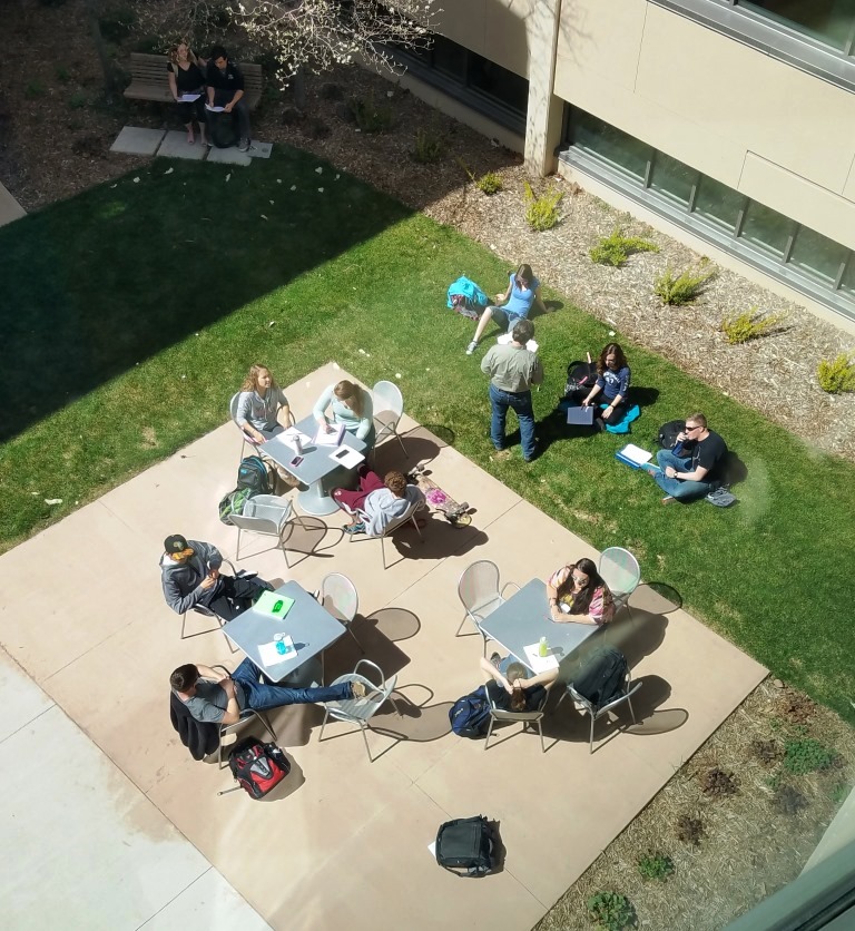 Ariel view of students outsite at tables
