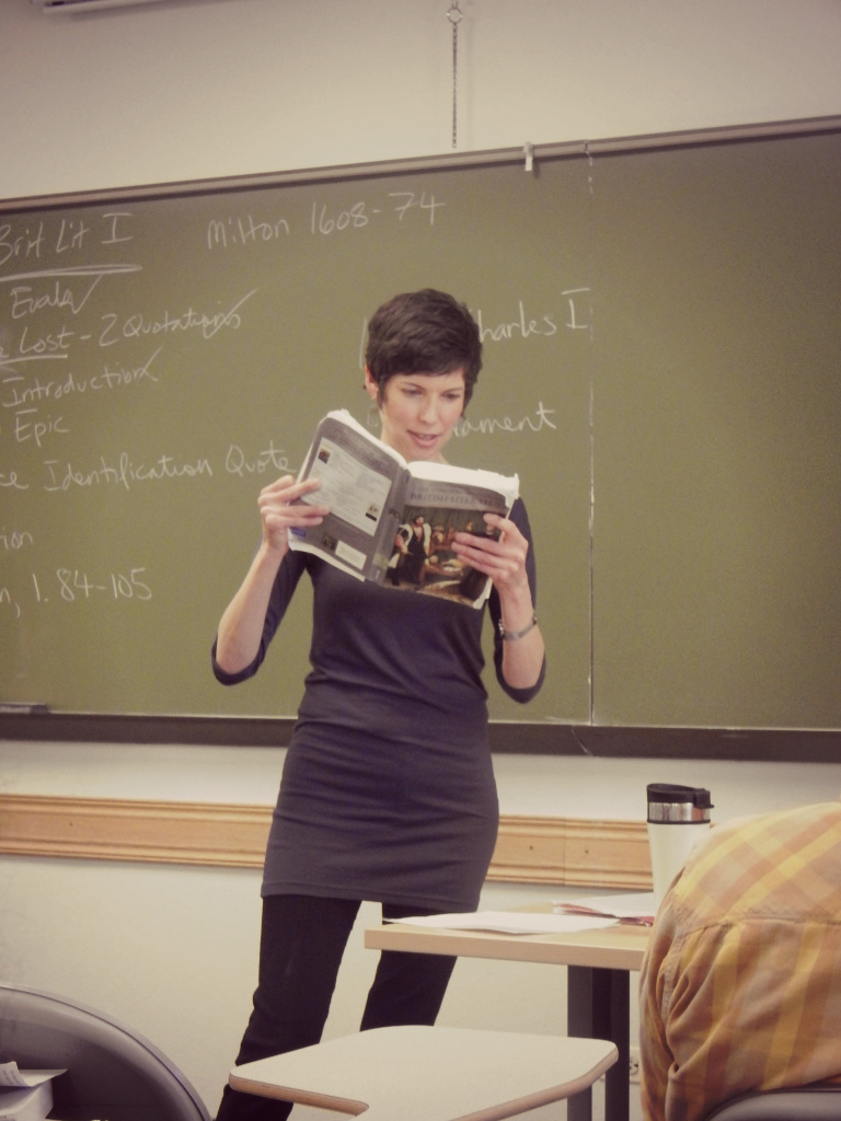 Professor teaching, reading from book