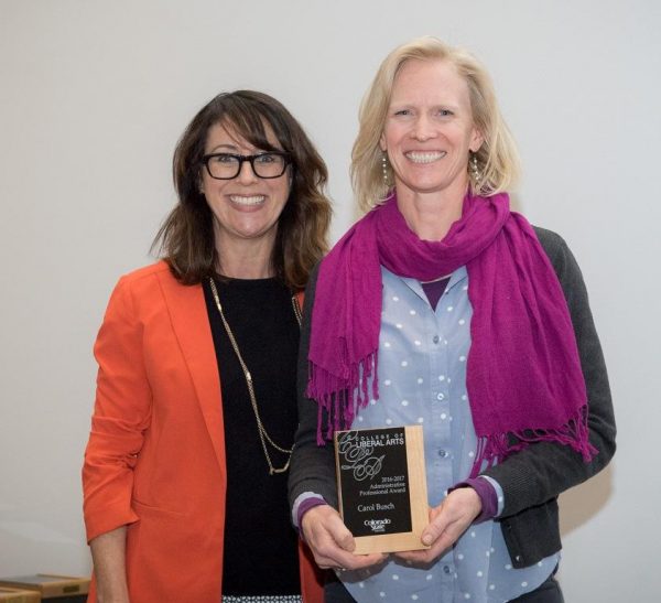 Roze presents Carol her award