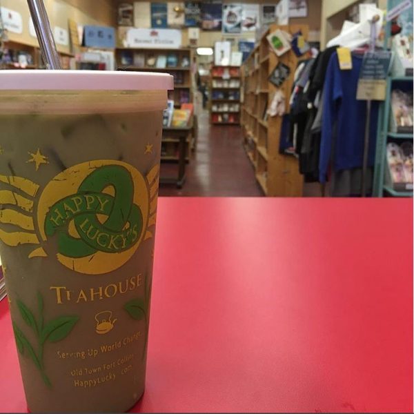 Glass of local Happy Lucky's Tea on the counter at Old Firehouse Books.