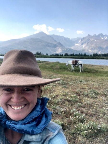Robin Walter with horse and mountains in background