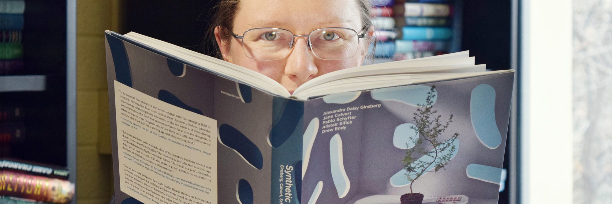 Erika Szymanski with book