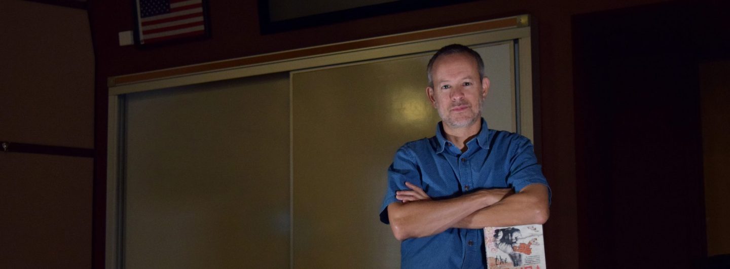 Andrew Altschul with his book The Gringa