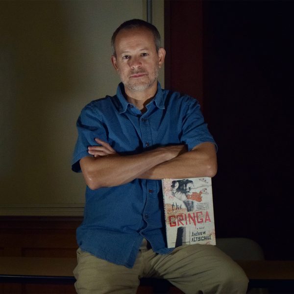 Andrew Altschul with his book The Gringa