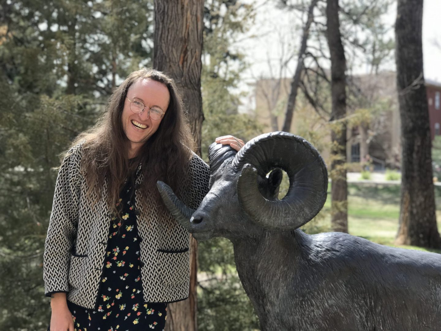 cookie egret standing near a ram statue on the CSU campus