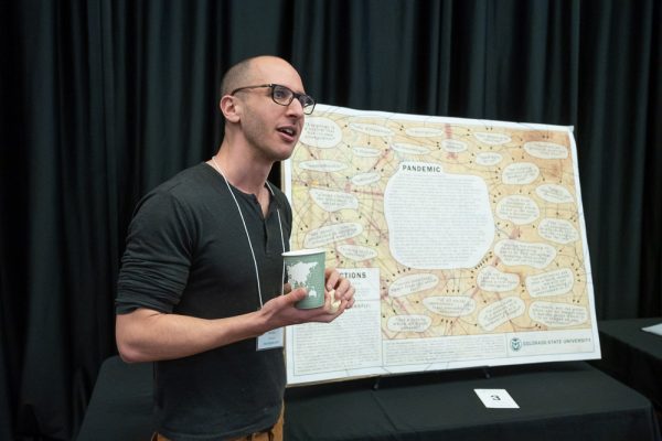 Jake Friedman presenting his poster at the 2022 GradShow.