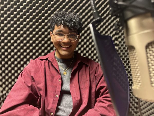 Ali Niaz sits in a podcast studio at Colorado State University, Feb. 6, 2024.